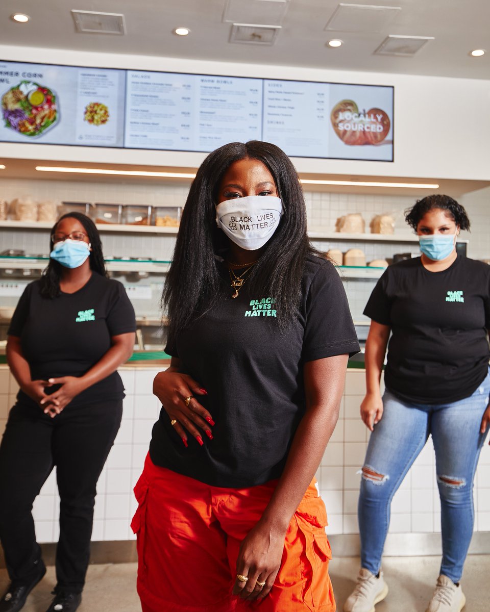 We partnered with our friend + artist Laci Jordan (<a href="/SoLaciLike/">Laci Jordan</a>) — pictured here with the artwork she created for our Santa Monica location last year — to design Black Lives Matter shirts for the 4,000 hardworking restaurant employees who bring our mission to life every day.