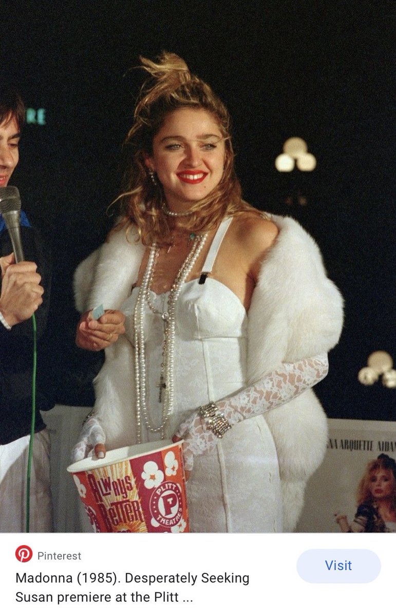 So it says there she knew about his clothes because she wore one of his corset dresses to the Desperately Seeking Susan Premiere in 1985. The dress is from his S/S 1985 collection Note the slight cone shape of the bust and suspender straps on the dress, a Gaultier design code.