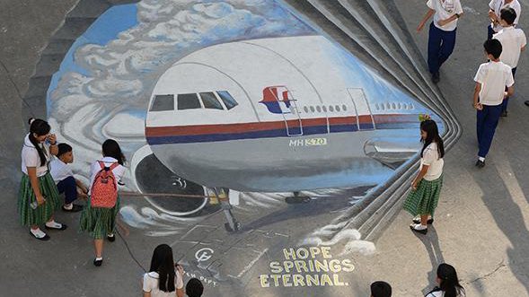 Yet another mural shows the missing flight returning through one. Were the passengers of MH370 taken to another dimension?