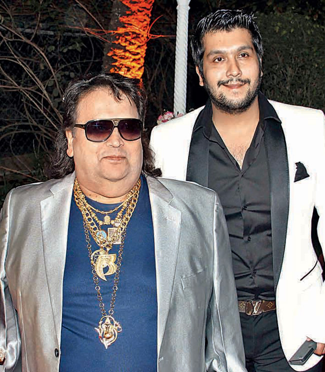 The father-son duo land in America, take the music label to court for using one of Bappi’s songs for a number on Billboards Top Ten.Bappi quarrels in court, demanding his name be mentioned on Billboards across all highways in foreign countries where the song is charting.