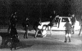 The title, Low End Theory, is a double entendre referring to both the status of black men in society and the gritty, deep bass frequencies in Tribe's music.Pictured: Rodney King beating, March 1991