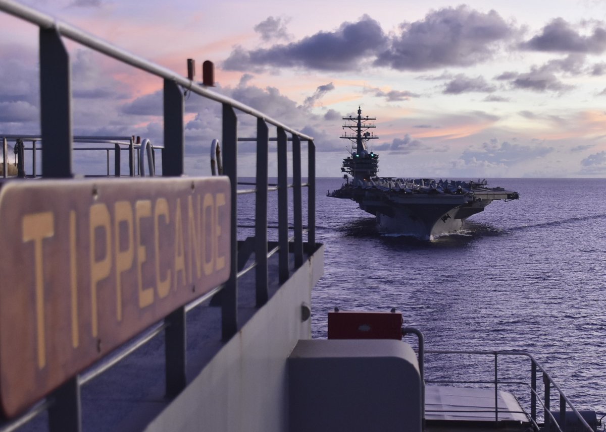 The forward-deployed @USNavy aircraft carrier #USSRonaldReagan (CVN 76) is prepared for an underway replenishment as it approaches the fleet replenishment oiler #USNSTippecanoe (T-AO 199) in the Philippine Sea.