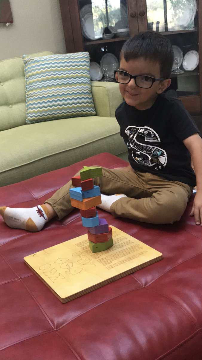 Silas decided it would be easier to flip the puzzle over for tower building. Then he was careful to use all the biggest pieces first. ⁦<a href="/Trianglemancsd/">Christopher Danielson</a>⁩