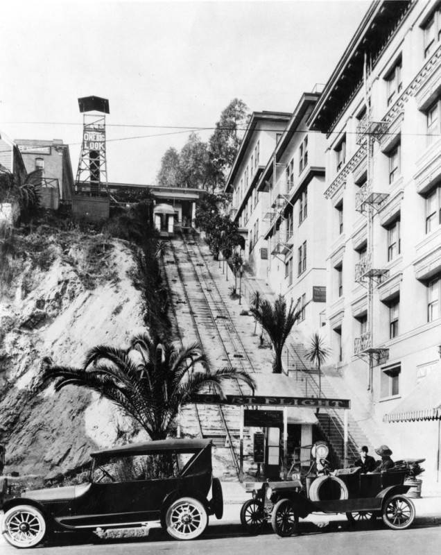 two cars parked in front of the Court Flight