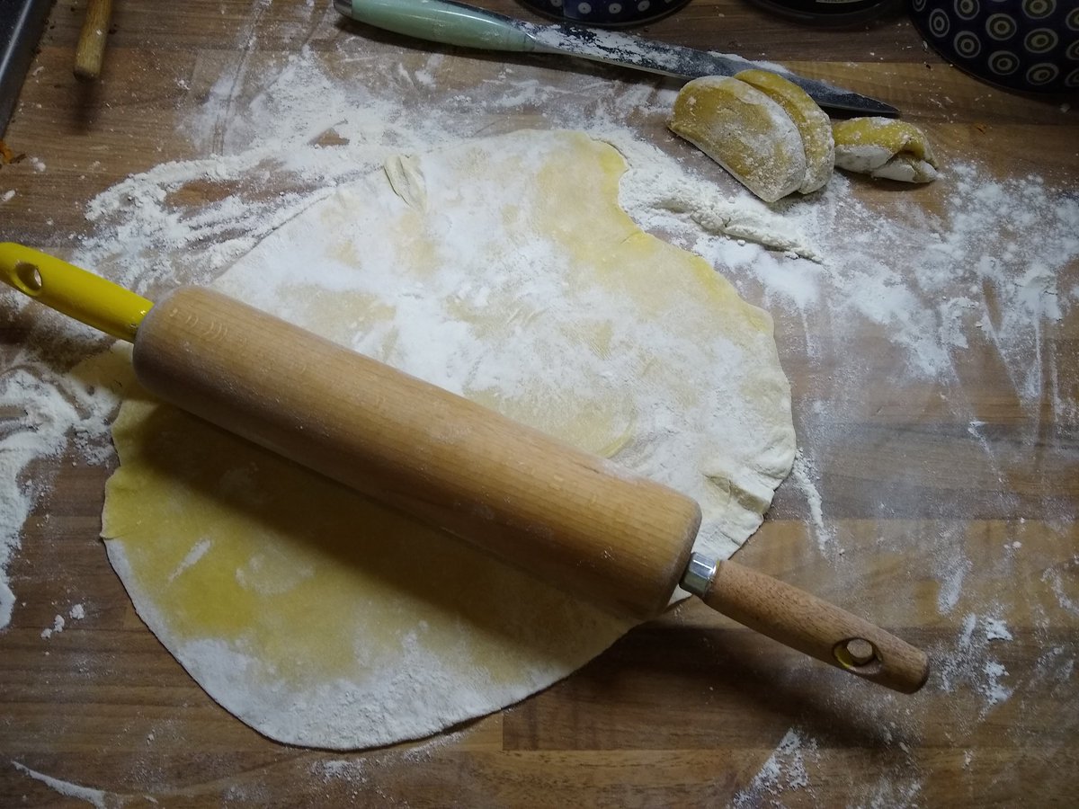 Roll your dough. Use plenty of flour. The shape doesn't really matter. You want it thin though.Once when a student and disorganised, I used an empty cider bottle to roll pastry dough. The is no fancy equipment here.