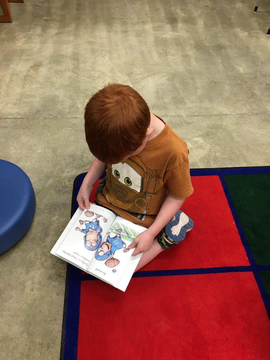 SpecialsMC2's tweet photo. Look who was caught reading 📙📘📗📕!!! #library https://t.co/SMGopZFzOA