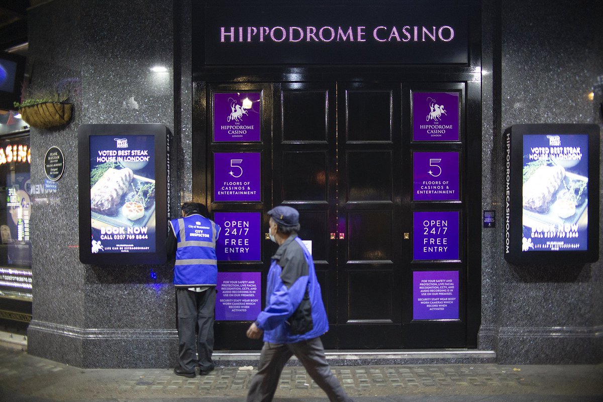 danbarker's tweet image. Strange sight - City Inspectors, working through Soho, looking for illegal speakeasies open after the 10pm cutoff.