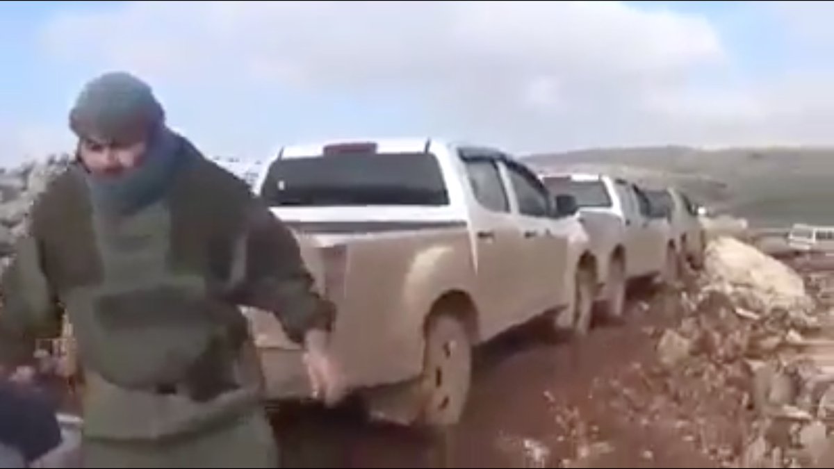 I have no idea what this HTS "jihadist" is wearing, but it's functional.The darks patches were covered by equipment. The light areas are the result of dust.He did NOT want to be filmed.