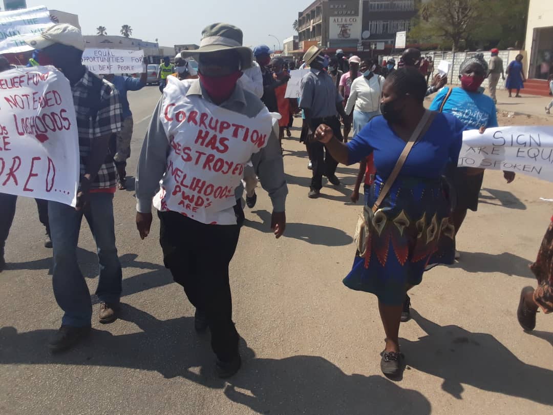 Henry_Chivhanga's tweet photo. "Get up, stand up, Stand up for your rights. Get up, stand up, Don't give up the fight.” - Bob Marley

Over 50 PWDs, especially from the deaf community have joined the march, taking a stand against corruption &amp; demanding social protection from govt
#TheMarchIsNotEnded https://t.co/p7rAS7kRIj