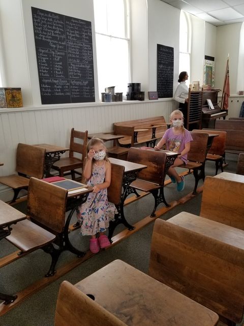 RNAO's tweet photo. Thank you to Julie for sending us this photo of her granddaughters at @SchoolsMuseum for our #Maskathon! #TogetherWeCanDoIt  

She noted the juxtaposition of 2020 school masking in the 1899 classroom. 

Keep wearing your masks proudly &amp; tagging us in your photos!📸 https://t.co/NkXx2MBL2m