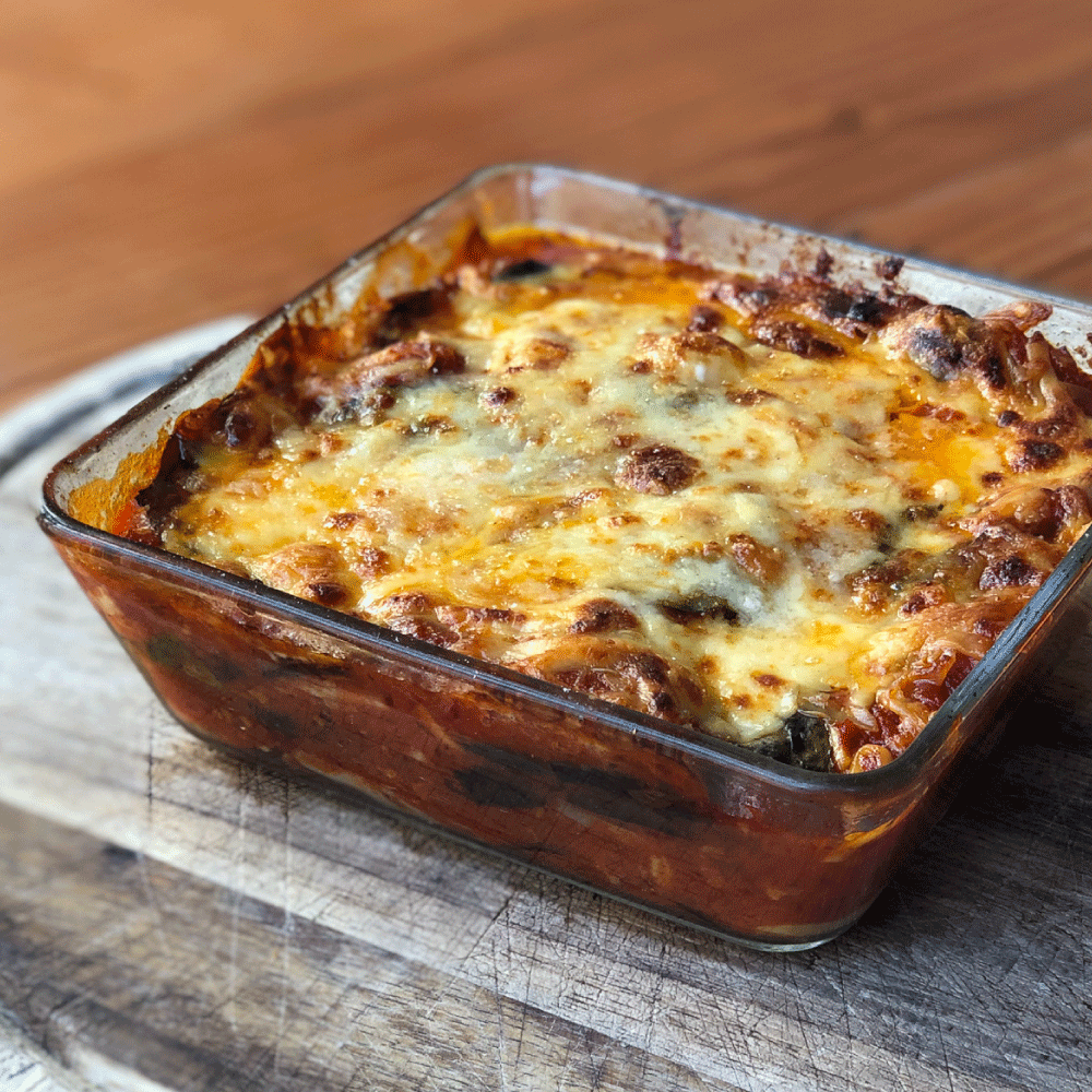 Comfort is an authentic parmigiana di melanzane (#eggplantparmesan), and it looks likes this. 👆Layers of #eggplant (straight from our #garden), baked with san marzano tomato sauce, basil, buffalo mozzarella &amp; parmigiano reggiano. It's heavenly, cheesy and, of course, #organic.