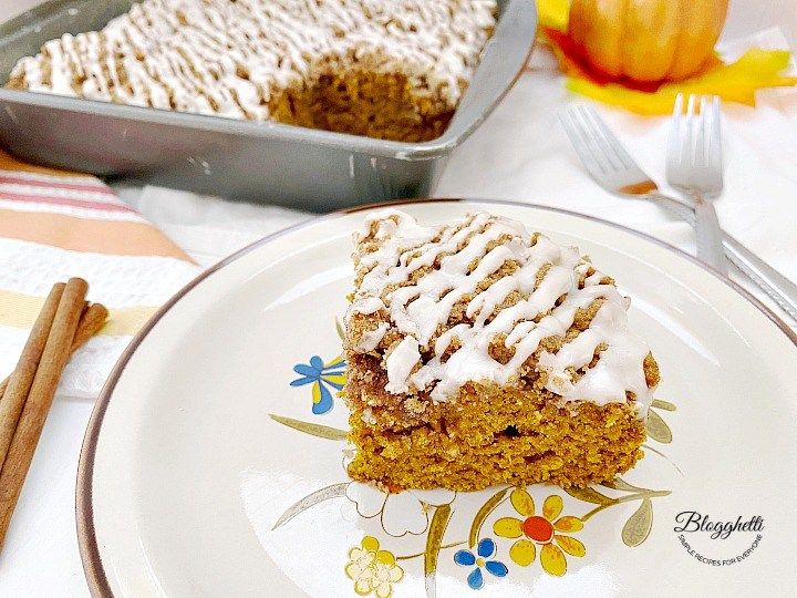 This recipe for Pumpkin Spice Coffee Cake is perfect for breakfast or dessert. The moist cake is filled with fall spices and pumpkin and topped with streusel and glaze. #cake #pumpkin #pumpkinspice #pumpkinweek buff.ly/3kTkdWh