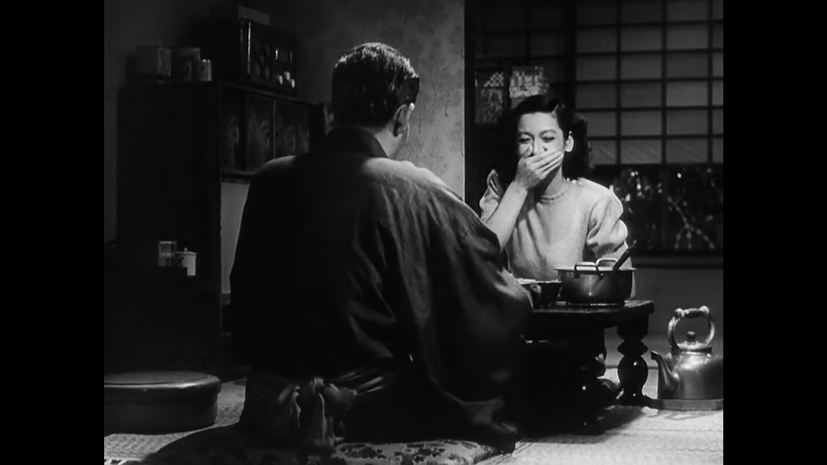 Again Ozu cuts to the over-the-shoulder (around-the-body?) shot for a better look at the full-body response from Noriko, this time breaking down in laughter as she reveals that Hattori is in fact already engaged.