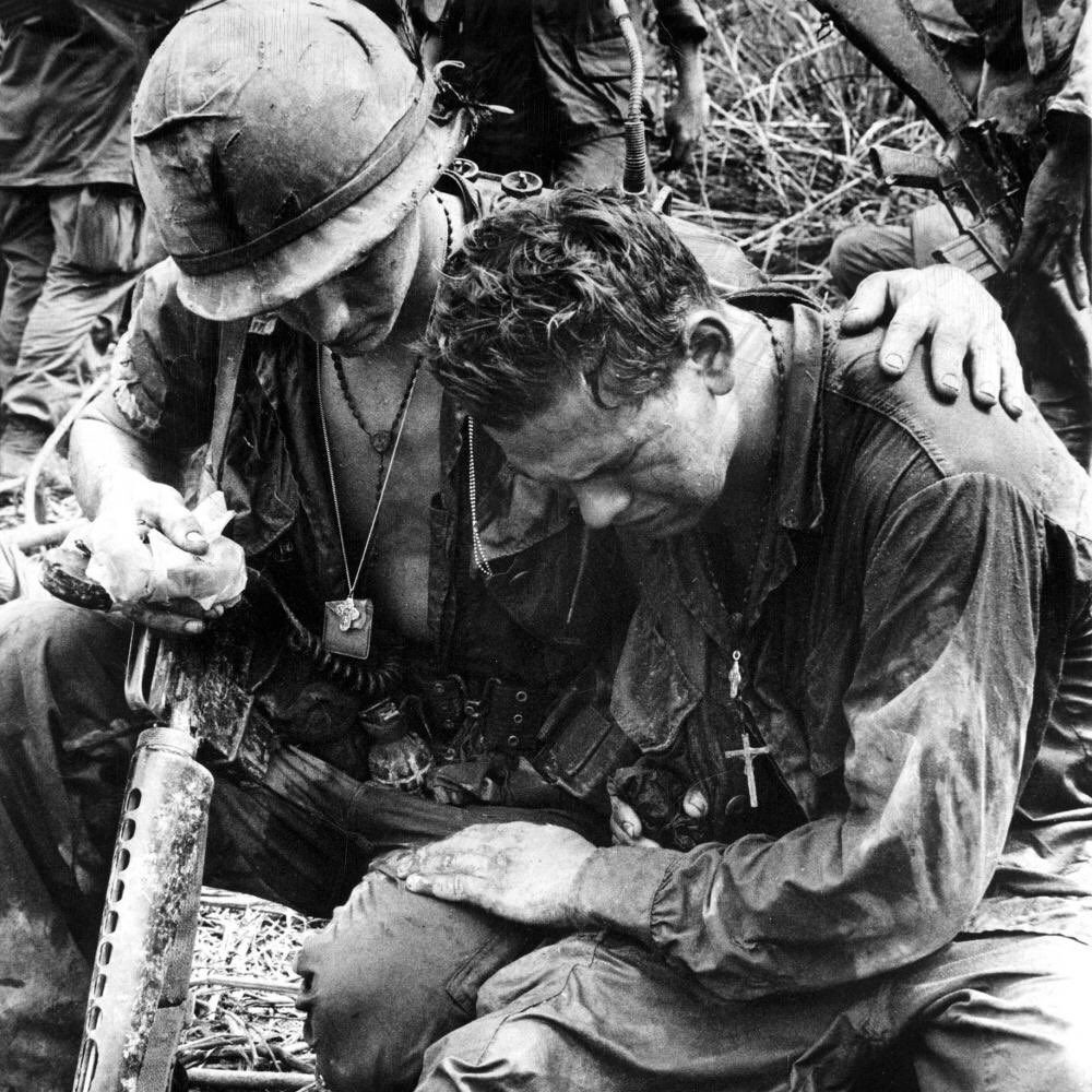 of him was shot to pieces...the very sea stained with American blood. The only blockers most had were the dead bodies in front of them, riddled with bullets from enemy fire.Take a knee in the sweat soaked jungles of Vietnam. from Khe San to Saigon...Anywhere will do. Americans