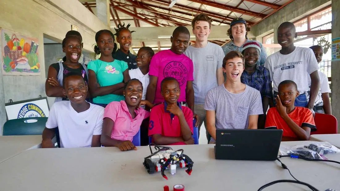 HaitiLibrary's tweet image. Summer 2017 group of students from Region 4 Valley Regional HS (Chester, Deep River, Essex) travelled to Deschapelles w/parents to share love of robotics. Group spent nearly a week working w/15 children ages 8-14 on how to build a robotic tractor (the Track3r) and maneuver it.