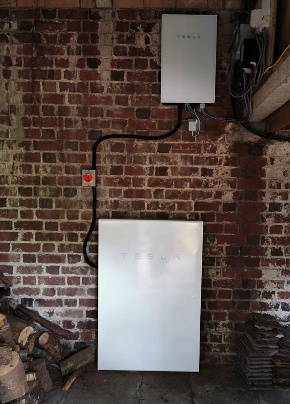 SunlightFuture's tweet image. A busy week ends with this beautiful custom solar car port. Built with @SolarEdgePV's EV-charger integrated inverter &amp;amp; 5.6kW of bifacial panels capable of absorbing sunlight bouncing off the shiny @Jaguar #ipace. Across the garden in an old dovecote a @Tesla #powerwall powers on!