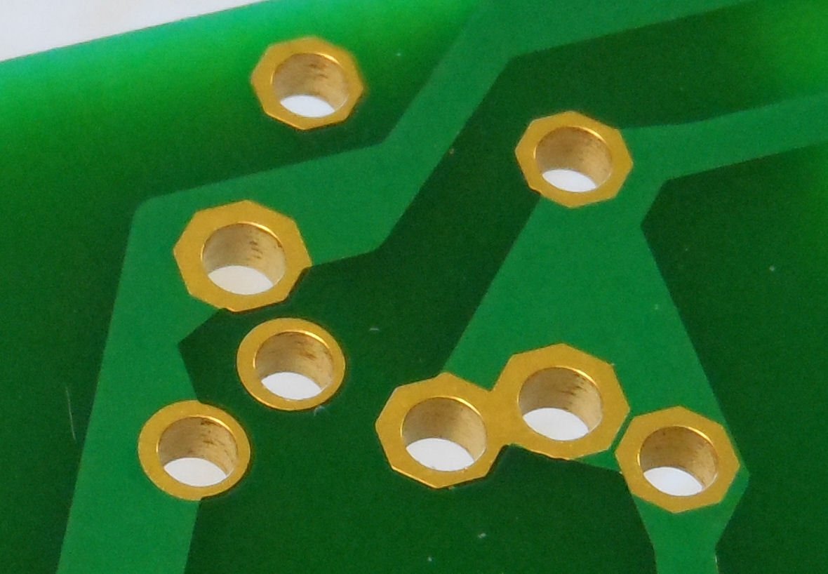 SMD is called that to distinguish it with the older through-hole technology. For through-hole, you instead have lots of little holes in the PCB, called "plated-through holes". They're plated with some conductive material, often gold.