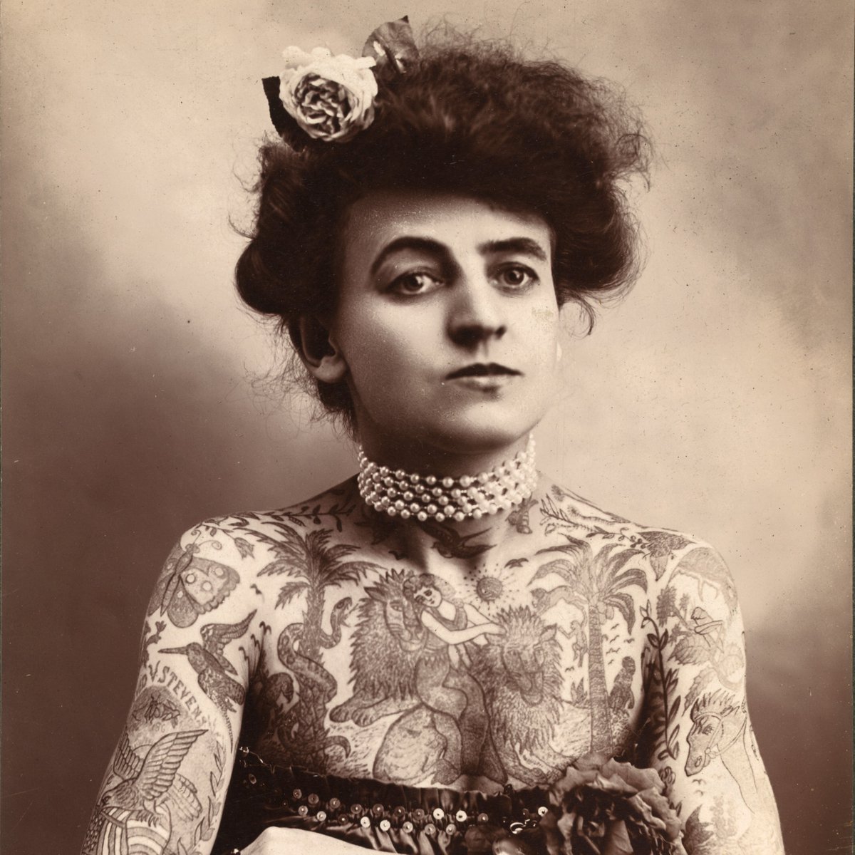 Maud Wagner (February 1877 – January 30, 1961). Maud joined a traveling circus to provide for herself as a teenager, and a chance meeting with a tattooed man would lead her to break the gender stigma around tattoos and to become the first woman tattoo artist in American history.