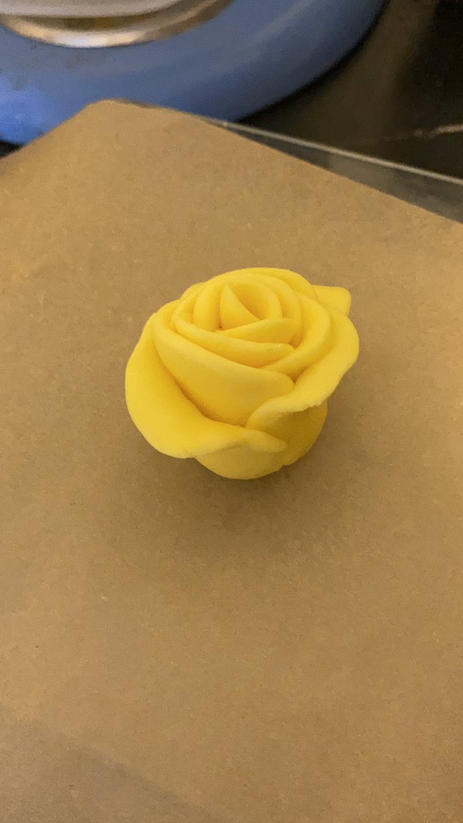 I am back! We had an ice cream and mountain vista interruption. Next up, the fondant rose. We have gone off book here because Mindy wanted yellow. The new fondant was much better.
