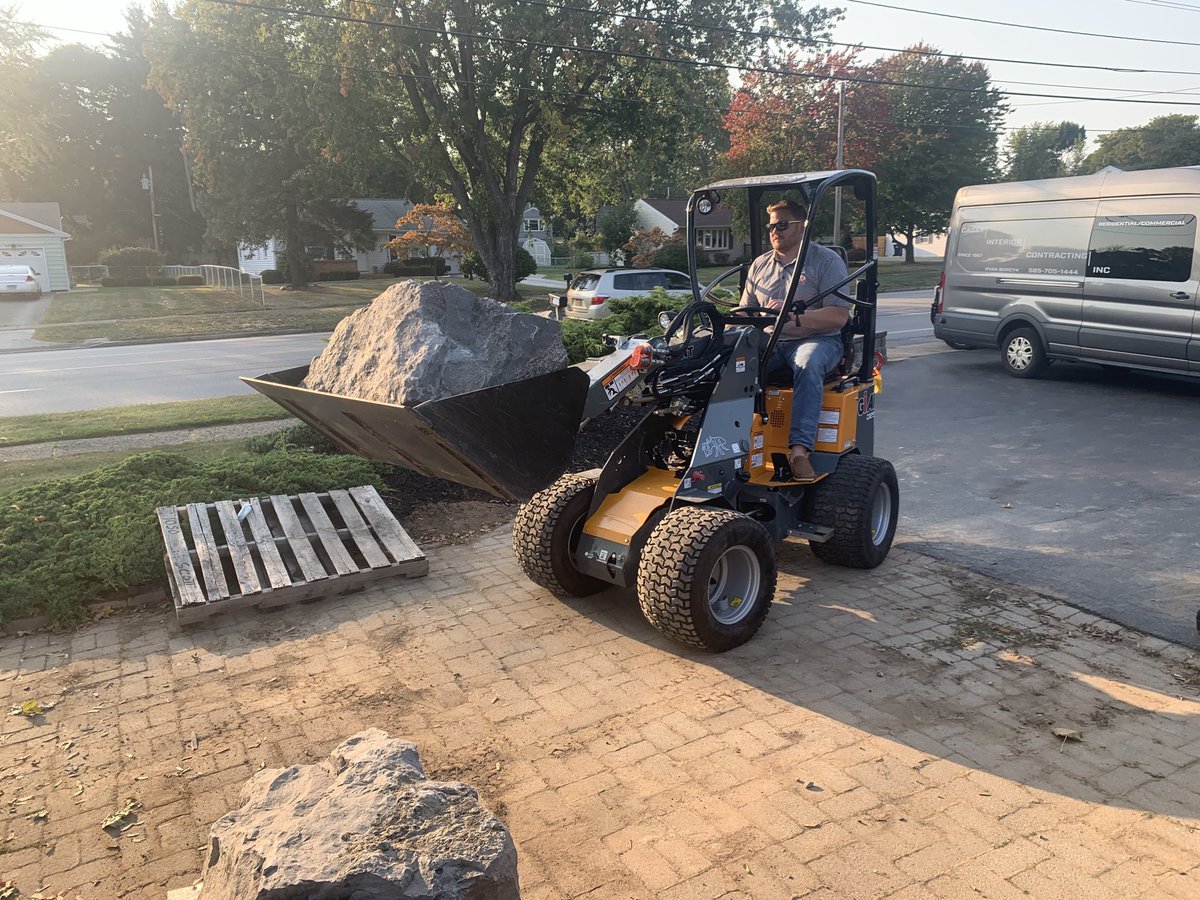MTEequipment's tweet photo. Small loader, big power, and it fits where you need it without destroying the ground beneath it! That’s a Giant 254 hauling a thousand pound boulder into place. https://t.co/VpDGRrHfET