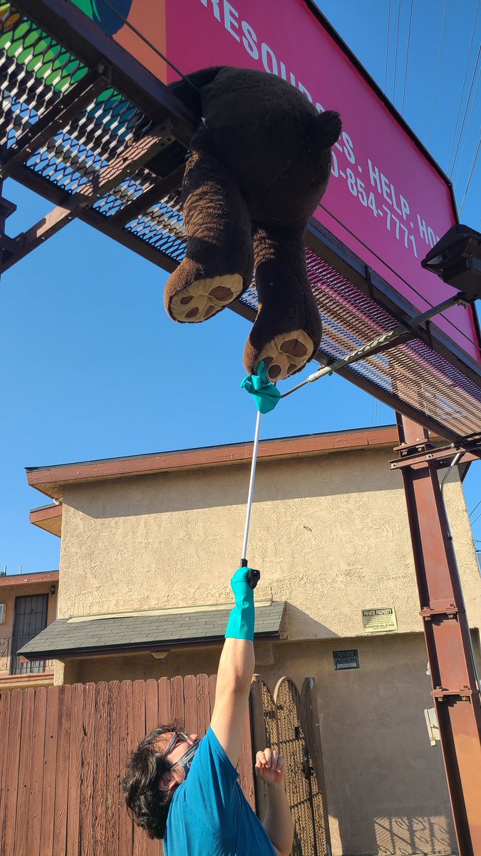 We got gloves, a claw arm, and a trash bag. Looks like we needed a little more vertical to do this. The claw didn't give good enough grip. We even tried putting the gloves on the claw, which gave some more grip, but not enough. Smacked it around a little but didn't knock it down.