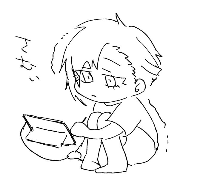 膝かかえて作業してる 