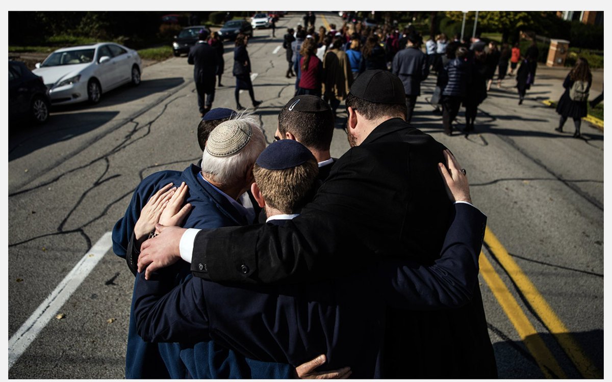 WEEK 103Mourners embrace during a processional outside of Congregation Beth Shalom for a funeral after the mass shooting at the Tree of Life Synagogue, October 31, 2018, the deadliest shooting of American Jews in history.