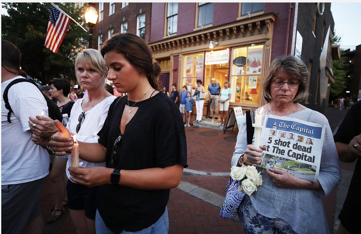 WEEK 85:People line up on both sides of Main St. during a candlelight vigil to honor the 5 people who were shot and killed at the Capital Gazette newspaper yesterday, on June 29, 2018 in Annapolis, Maryland. Jarrod Ramos was arrested and charged. https://theweeklylist.org/weekly-list/week-85/