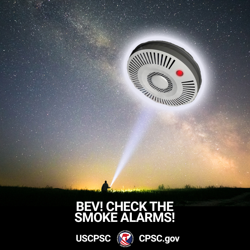 A giant smoke alarm in the sky. A guy with a flashlight is pointing up at it. The text reads: bev! Check the smoke alarms!