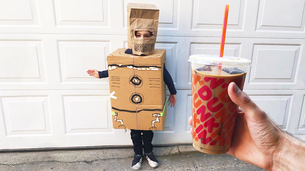 dunkindonuts's tweet photo. Some people can make an amazing Halloween costume out of cardboard. 👻 For the rest of us there’s Iced Oatmilk Lattes. 😜 #FallFails https://t.co/zeRyZG4UNj