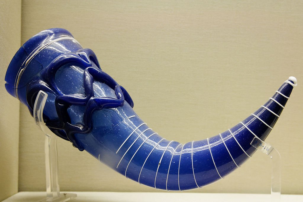 The fabulous late 6th-century Lombardic blue glass drinking horn that was found at Sutri, Italy:  https://commons.m.wikimedia.org/wiki/File:Glass_drinking_horn_BM_MME1887.01-08.2.jpg
