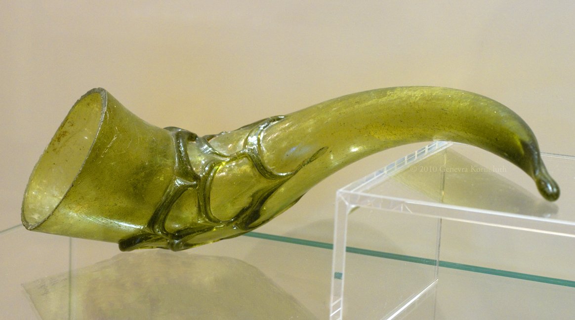 A 6th-century glass drinking horn from Rommersheim grave 6, Germany:  http://www.kornbluthphoto.com/images/GlassHorn2.jpg
