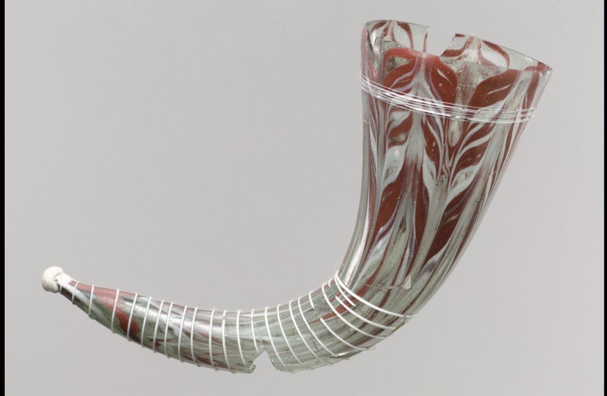 A lovely early medieval glass drinking horn, late 6th-/early 7th-century and Lombardic, made N. Italy:  https://www.metmuseum.org/art/collection/search/468980?rpp=20&pg=37&ft=glass&pos=731&imgno=0&tabname=label