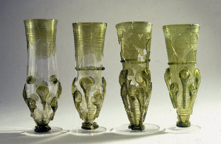 Four green glass claw beakers, found in the early 7th-century Anglo-Saxon barrow burial at Taplow:  https://www.britishmuseum.org/research/...
