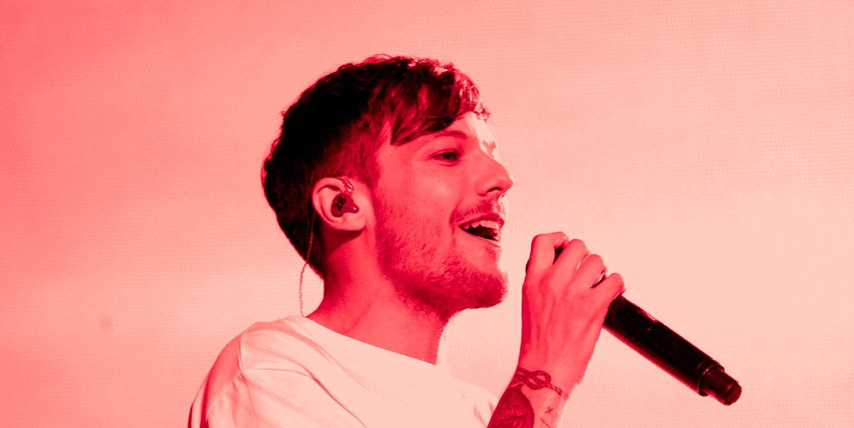 Louis Tomlinson in a red filter coz this man fooking owns this color !!