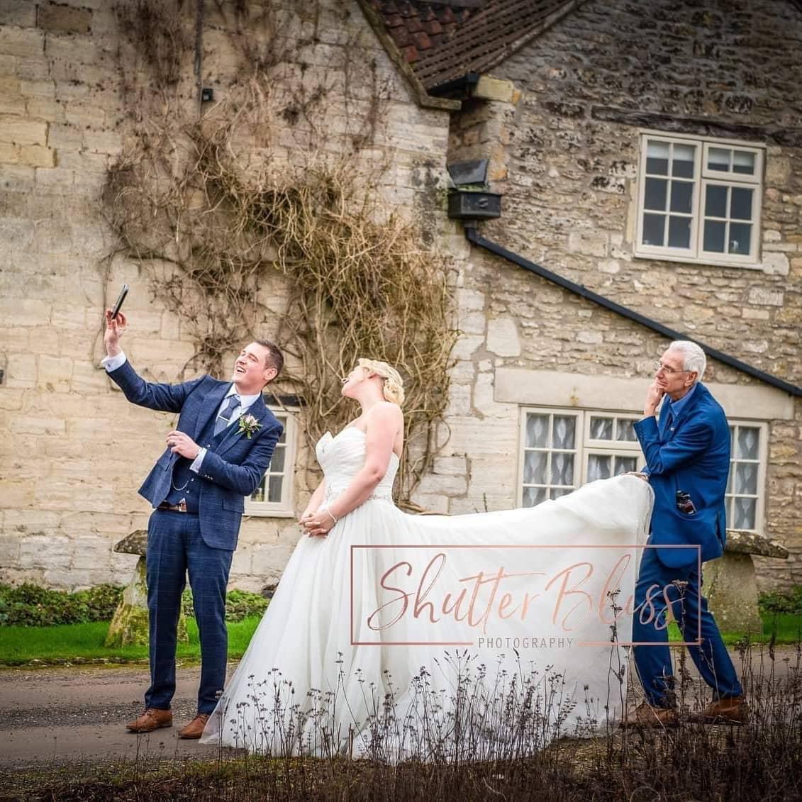 We love this little behind the scenes moment from Shutter Bliss Photography , going the extra mile to get that perfect shot whilst the groom snaps a selfie. We can’t wait to see the wedding album.