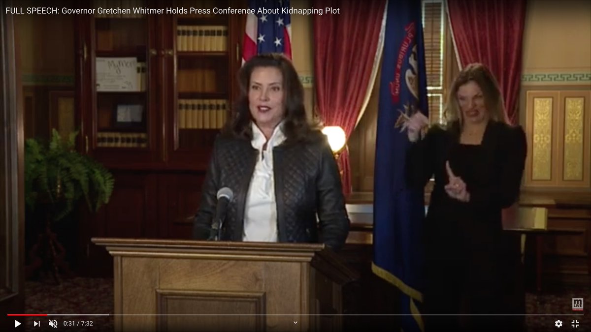 It was fitting that Whitmer's sign-language interpreter seemed off her rocker.