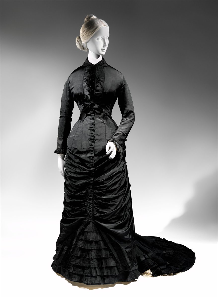 Dresses were trimmed with crape, a hard, scratchy silk with a peculiar crimped appearance produced by heat. Crape is particularly associated with mourning because it doesn’t combine well with any other clothing – you can’t wear velvet or satin or lace or embroidery with it.