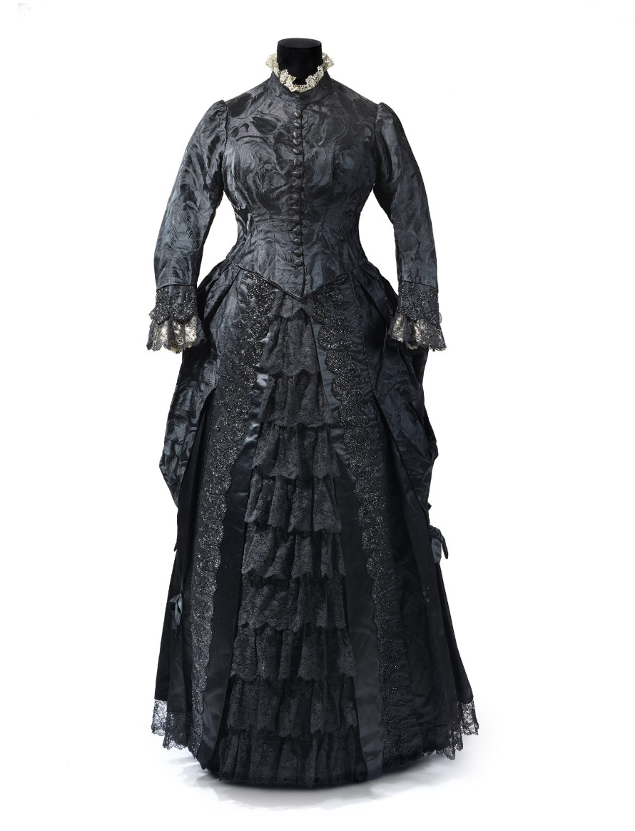 Dresses were trimmed with crape, a hard, scratchy silk with a peculiar crimped appearance produced by heat. Crape is particularly associated with mourning because it doesn’t combine well with any other clothing – you can’t wear velvet or satin or lace or embroidery with it.