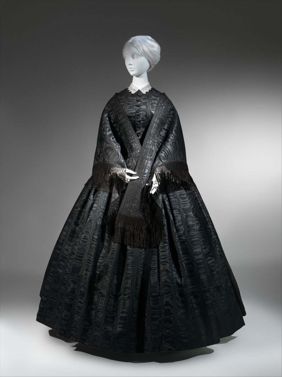 Dresses were trimmed with crape, a hard, scratchy silk with a peculiar crimped appearance produced by heat. Crape is particularly associated with mourning because it doesn’t combine well with any other clothing – you can’t wear velvet or satin or lace or embroidery with it.