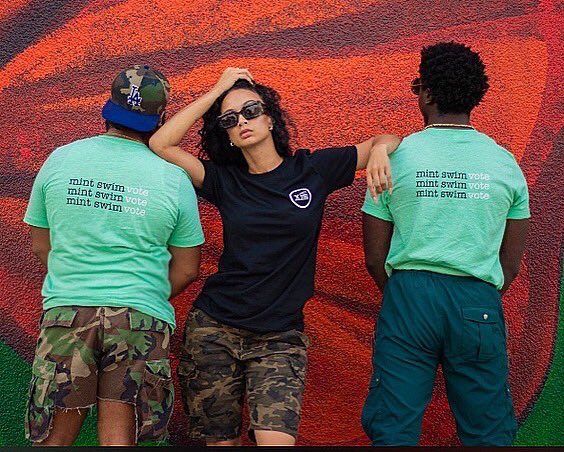 HollywoodJustin's tweet photo. Our collab with #MintSwim and @drayamichele is finally here! Go grab you a tee and make sure youโre registered to VOTE VOTE VOTE VOTE November 3rd!! https://t.co/1wfbANEFgP #BlackoutTheBallot #Retweet https://t.co/sj6MEa7Y9H