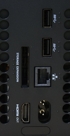Back of the Xbox Series X showing the ports with tactile indicators (dots or lines) over each port to give you a way to tell what they are. 