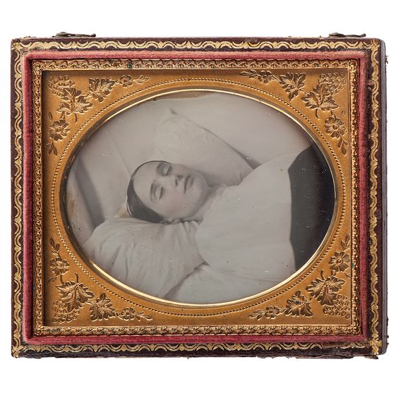 The invention of the daguerreotype in 1839 by Louis-Jacques-Mandé Daguerre gave rise to post-mortem photographs. A common practice would be to pose the deceased in a realistic domestic setting.