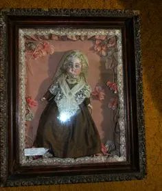 The dolls were usually left at the child's grave site, but some families would keep them in the home as a memento - in a small glass coffin, a frame, or even a crib.