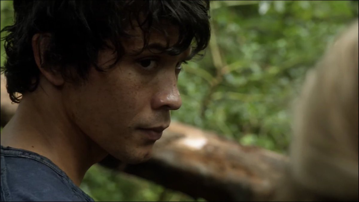 “She ignores him, her eyes locked on a curious Bellamy”