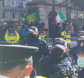 WSMIreland's tweet photo. Large force of Garda arrived and pushed back the anti-fascists leaving the fascists of the National Party cowering against the Dail wall.  Predictable complete loss of courage on their part when numbers are not massively on their side &amp; they haven't been allowed bring weapons https://t.co/kjZdNAZ0Aw