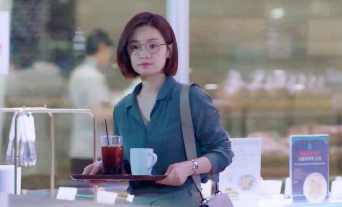 Songhwa knew that Ikjun came to work in the morning on a bikeShe thought he might be hot so she ordered ice coffeeOr he might want hot coffeeIt was evident that she hadn't drank yet, she waited for him to choose first
