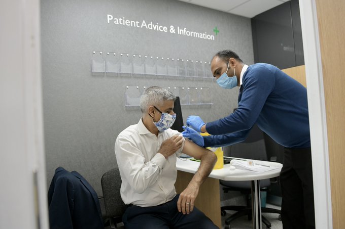 Mayor of London, Sadiq Khan, is administered a flu jab at a pharmacy. 