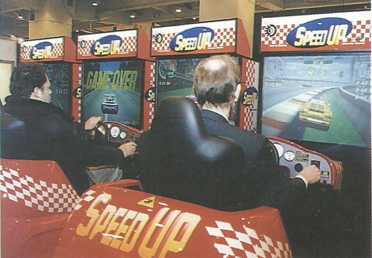 En 1996, dan el salto a las 3D con “Speed Up”, del que desarrollan su hardware, software y un mueble sin nada que envidiar a los de las grandes empresas japonesas como  #Sega o  #Namco. “Speed Up” fue distribuido a nivel mundial a través de Namco.