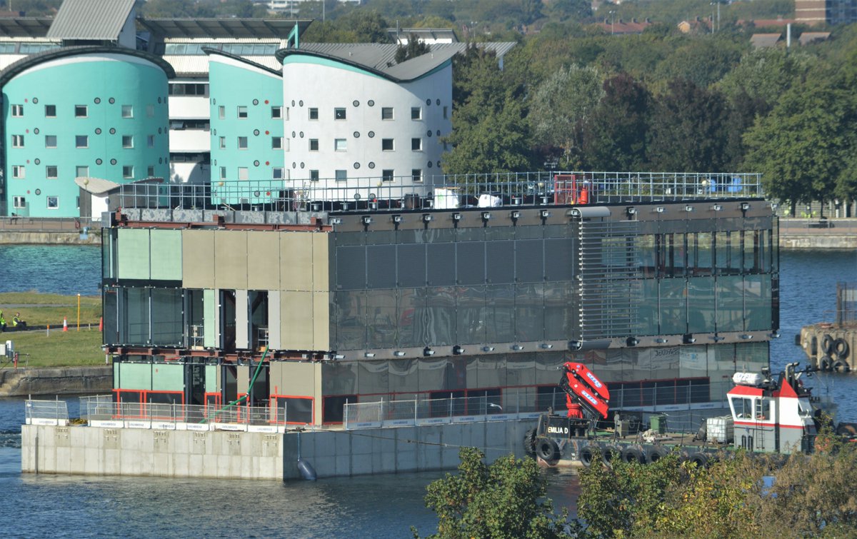 AJBC_1's tweet photo. .@Thamescraft vessels DEVOUT & EMILIA D dropped by the #KGVLock today to swing one of the #WoodWharf floating buildings to allow work to continue on the other face of the building.
@DocksMgmt #RoyalDocks #London
#dlr_blog https://t.co/HjvOtgh0zJ